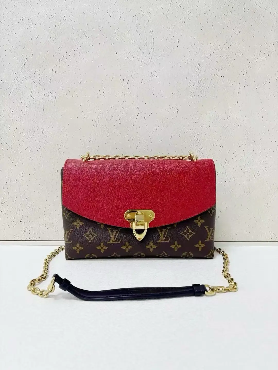 LOUIS VUITTON Saint Placide Envelope Bag in Red Monogram Empreinte Leather LOUIS VUITTON Saint Placide Envelope Bag in Red Monogram Empreinte Leather