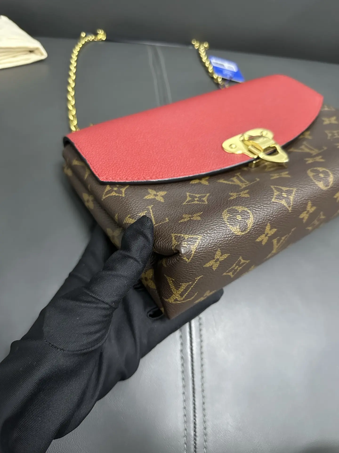 LOUIS VUITTON Saint Placide Envelope Bag in Red Monogram Empreinte Leather LOUIS VUITTON Saint Placide Envelope Bag in Red Monogram Empreinte Leather