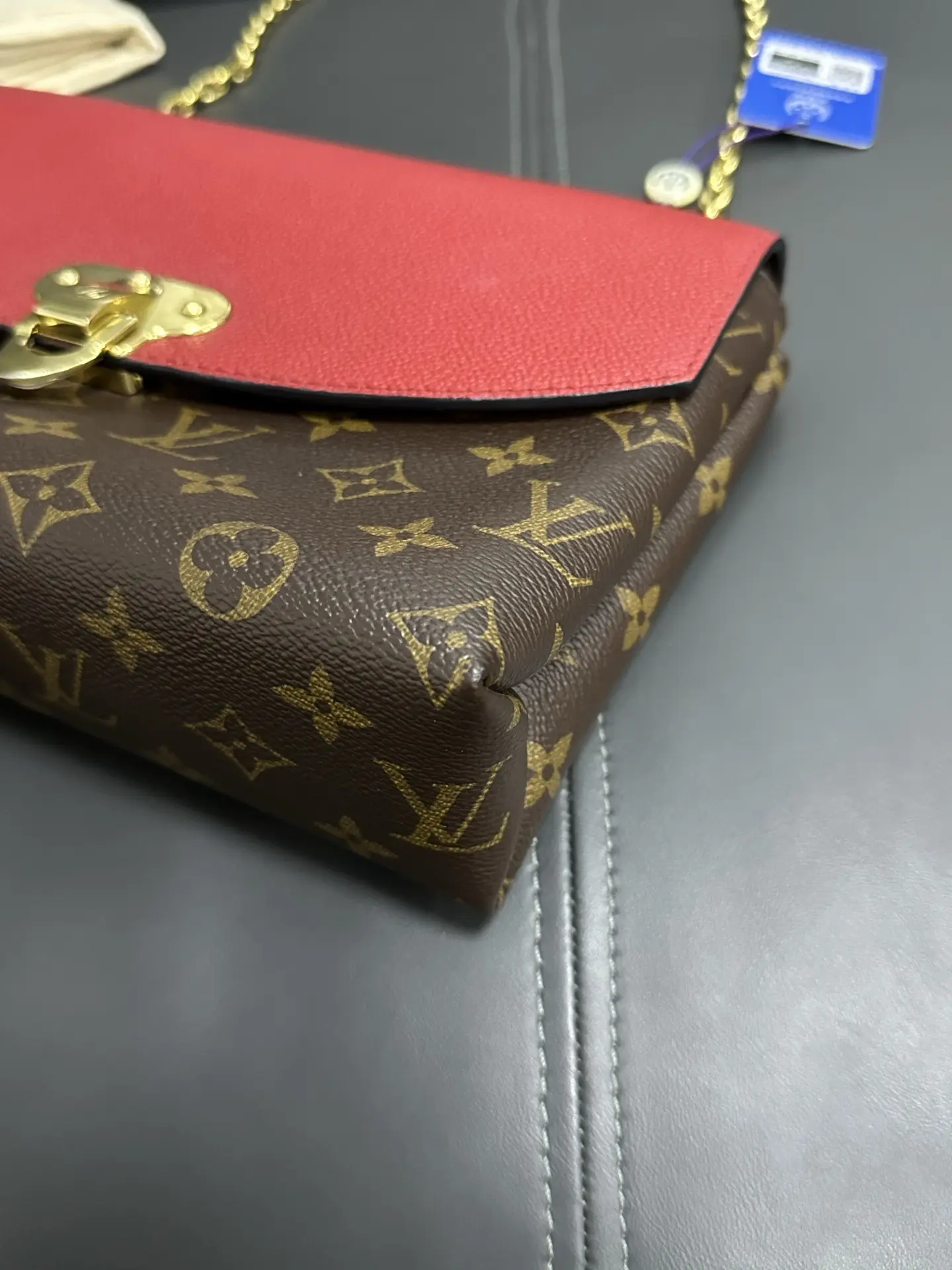 LOUIS VUITTON Saint Placide Envelope Bag in Red Monogram Empreinte Leather LOUIS VUITTON Saint Placide Envelope Bag in Red Monogram Empreinte Leather