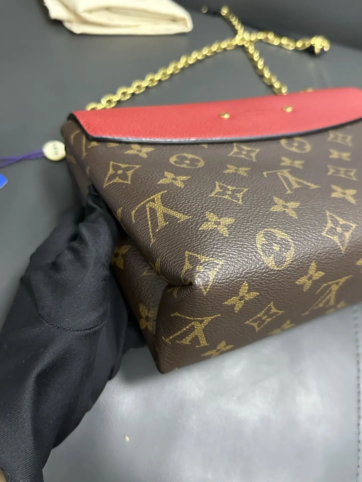 LOUIS VUITTON Saint Placide Envelope Bag in Red Monogram Empreinte Leather LOUIS VUITTON Saint Placide Envelope Bag in Red Monogram Empreinte Leather