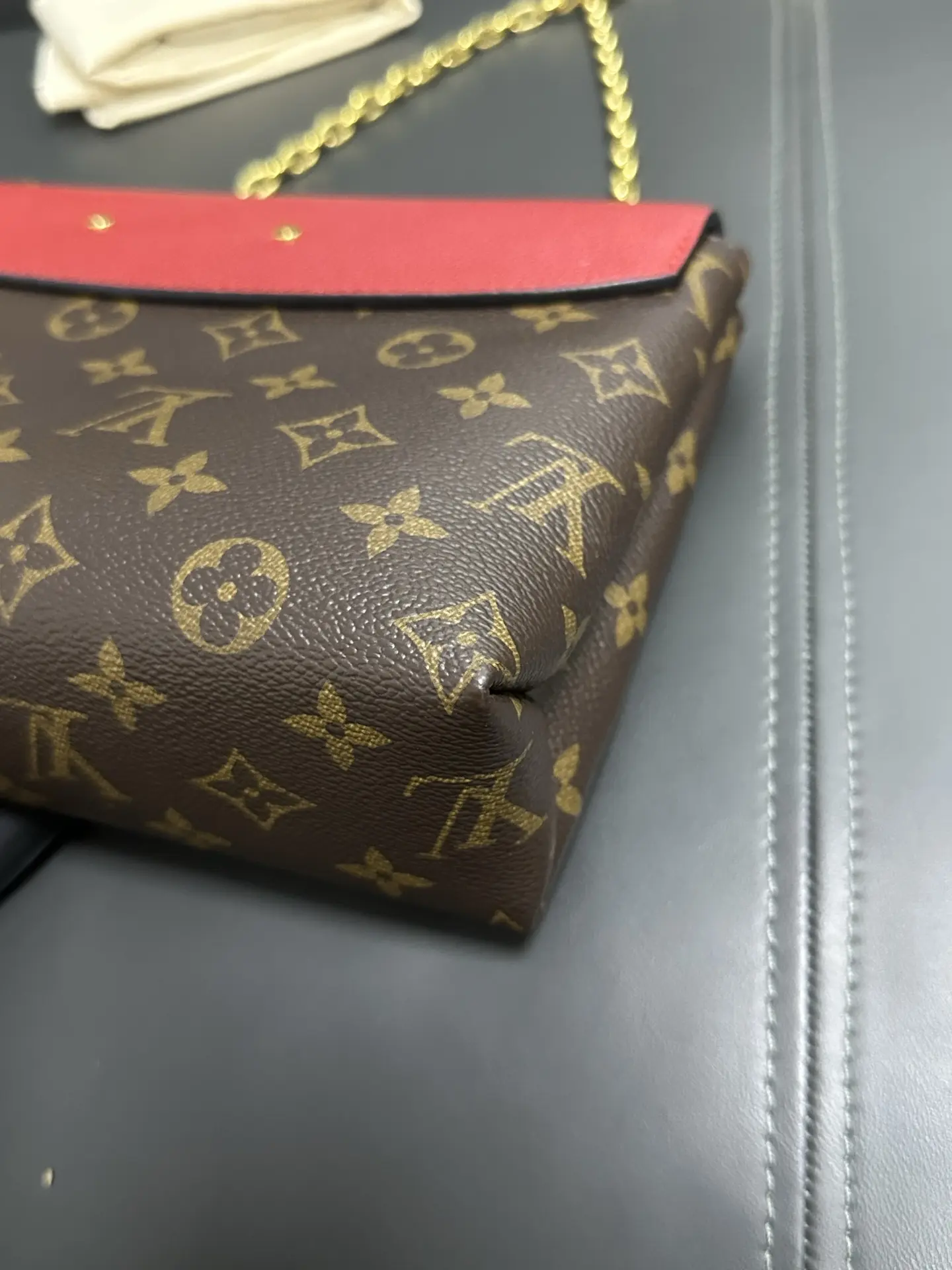 LOUIS VUITTON Saint Placide Envelope Bag in Red Monogram Empreinte Leather LOUIS VUITTON Saint Placide Envelope Bag in Red Monogram Empreinte Leather