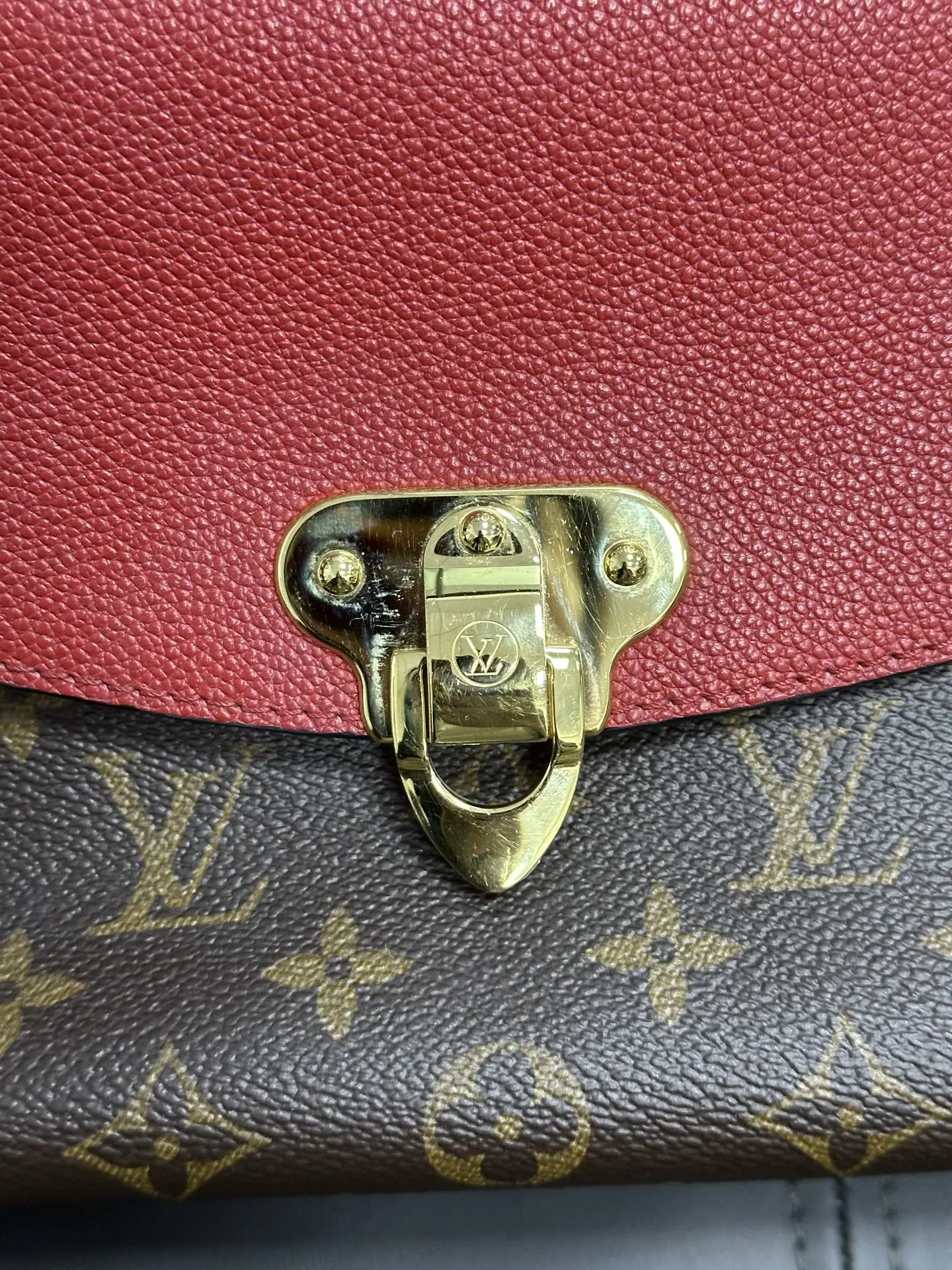 LOUIS VUITTON Saint Placide Envelope Bag in Red Monogram Empreinte Leather LOUIS VUITTON Saint Placide Envelope Bag in Red Monogram Empreinte Leather