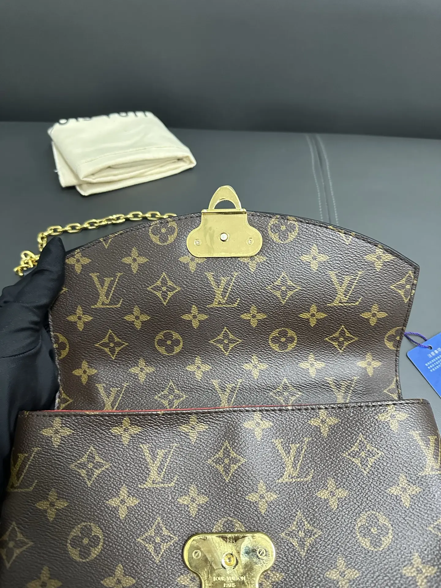 LOUIS VUITTON Saint Placide Envelope Bag in Red Monogram Empreinte Leather LOUIS VUITTON Saint Placide Envelope Bag in Red Monogram Empreinte Leather