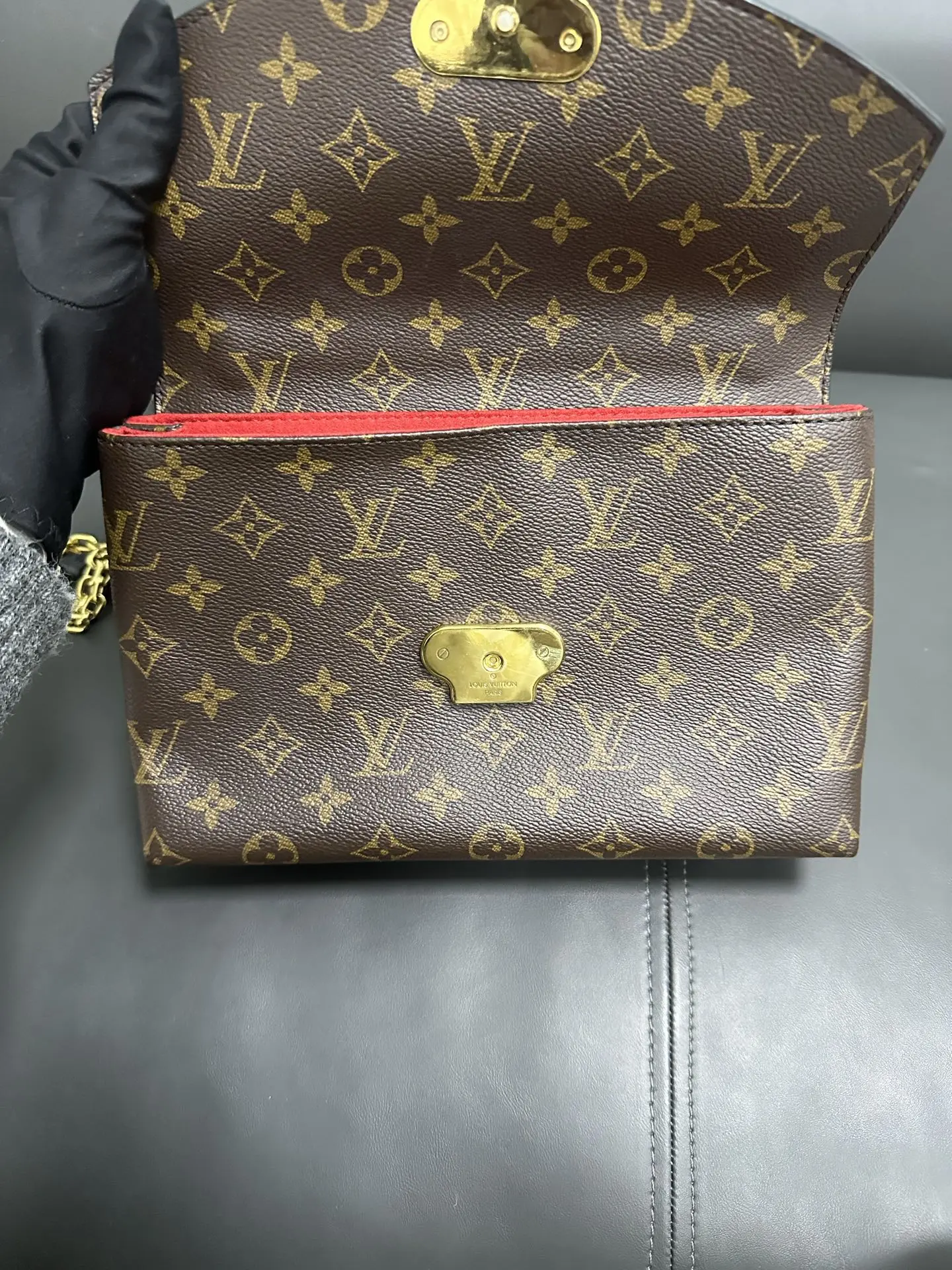 LOUIS VUITTON Saint Placide Envelope Bag in Red Monogram Empreinte Leather LOUIS VUITTON Saint Placide Envelope Bag in Red Monogram Empreinte Leather