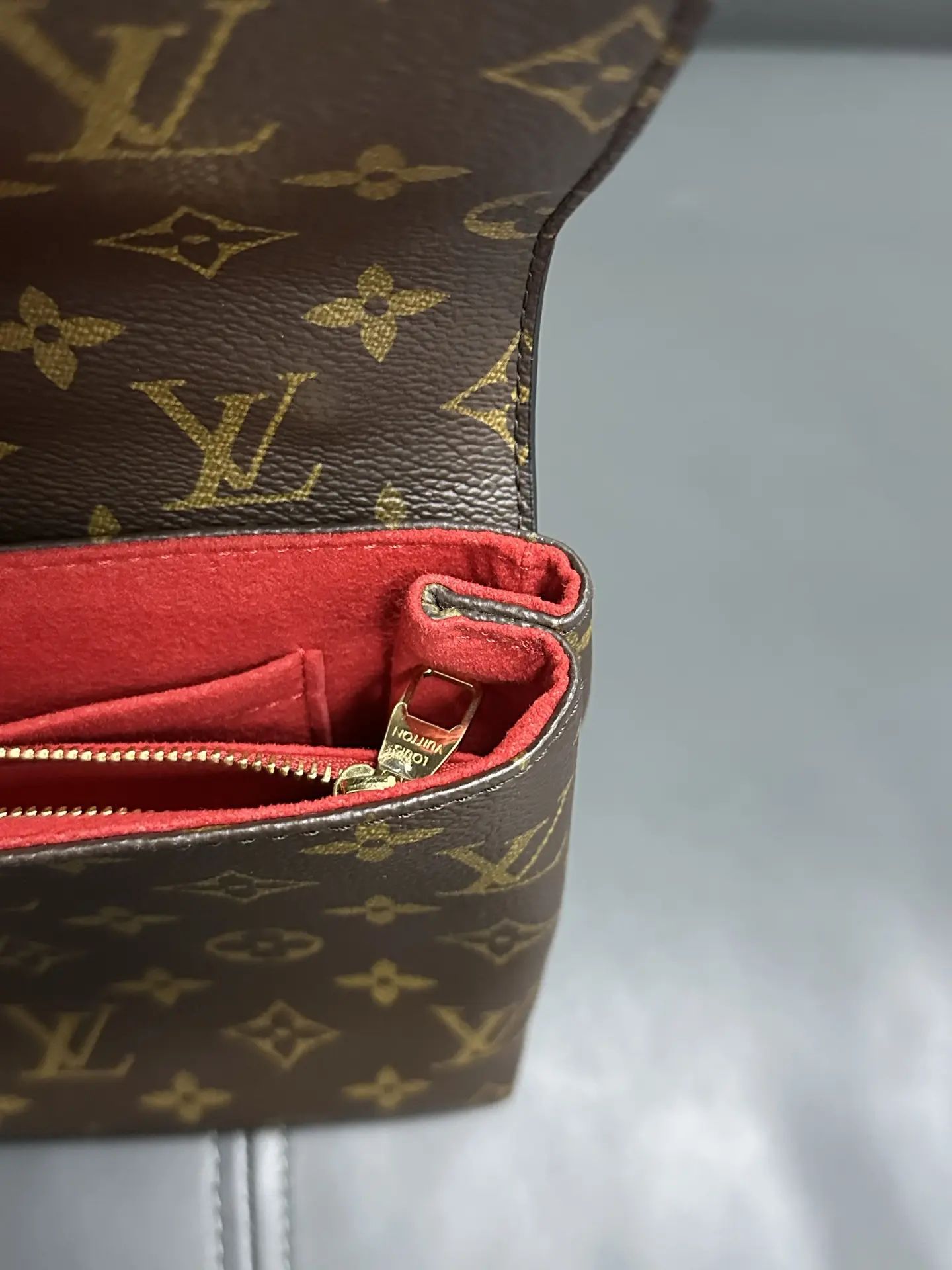 LOUIS VUITTON Saint Placide Envelope Bag in Red Monogram Empreinte Leather LOUIS VUITTON Saint Placide Envelope Bag in Red Monogram Empreinte Leather