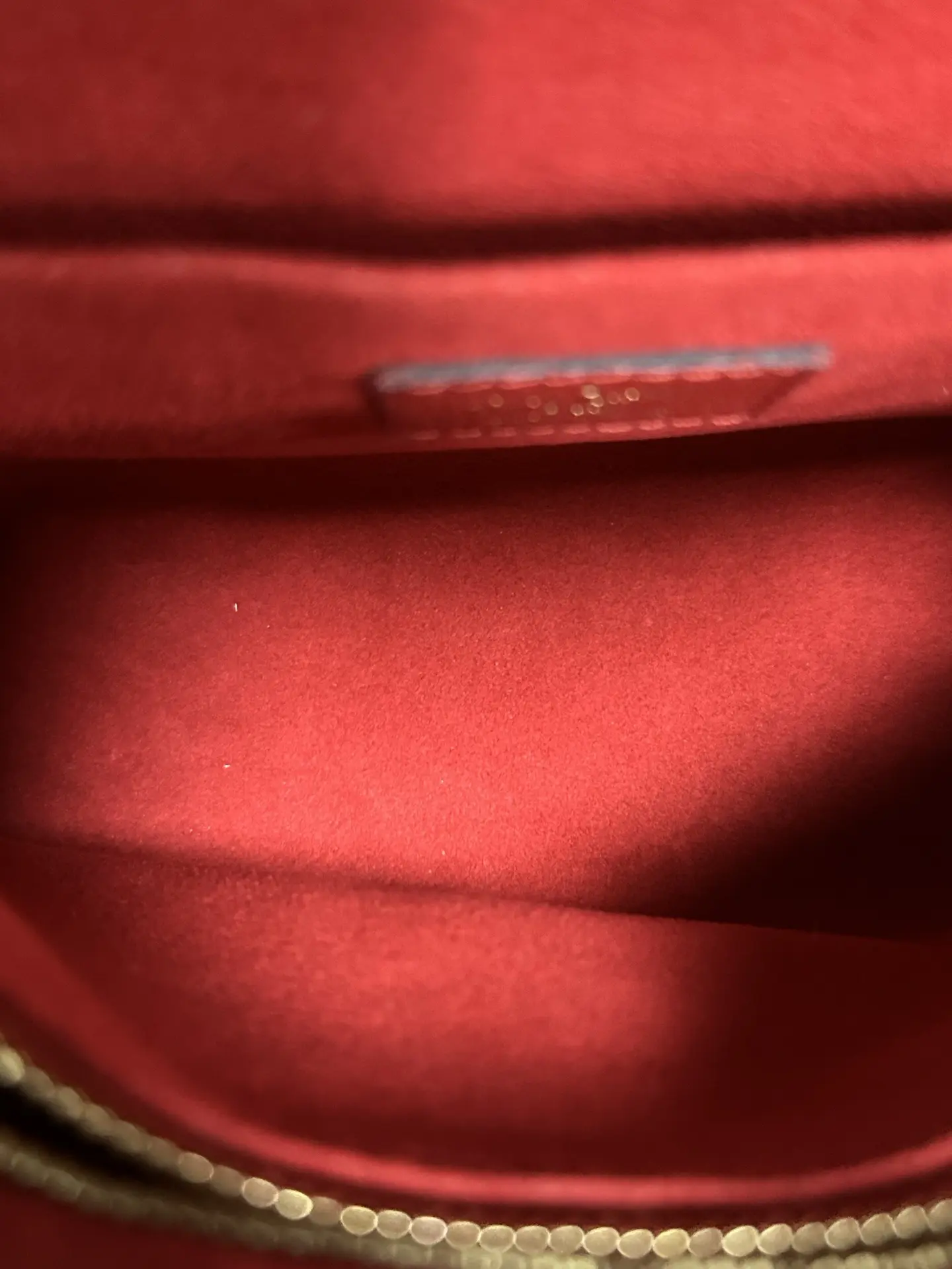 LOUIS VUITTON Saint Placide Envelope Bag in Red Monogram Empreinte Leather LOUIS VUITTON Saint Placide Envelope Bag in Red Monogram Empreinte Leather