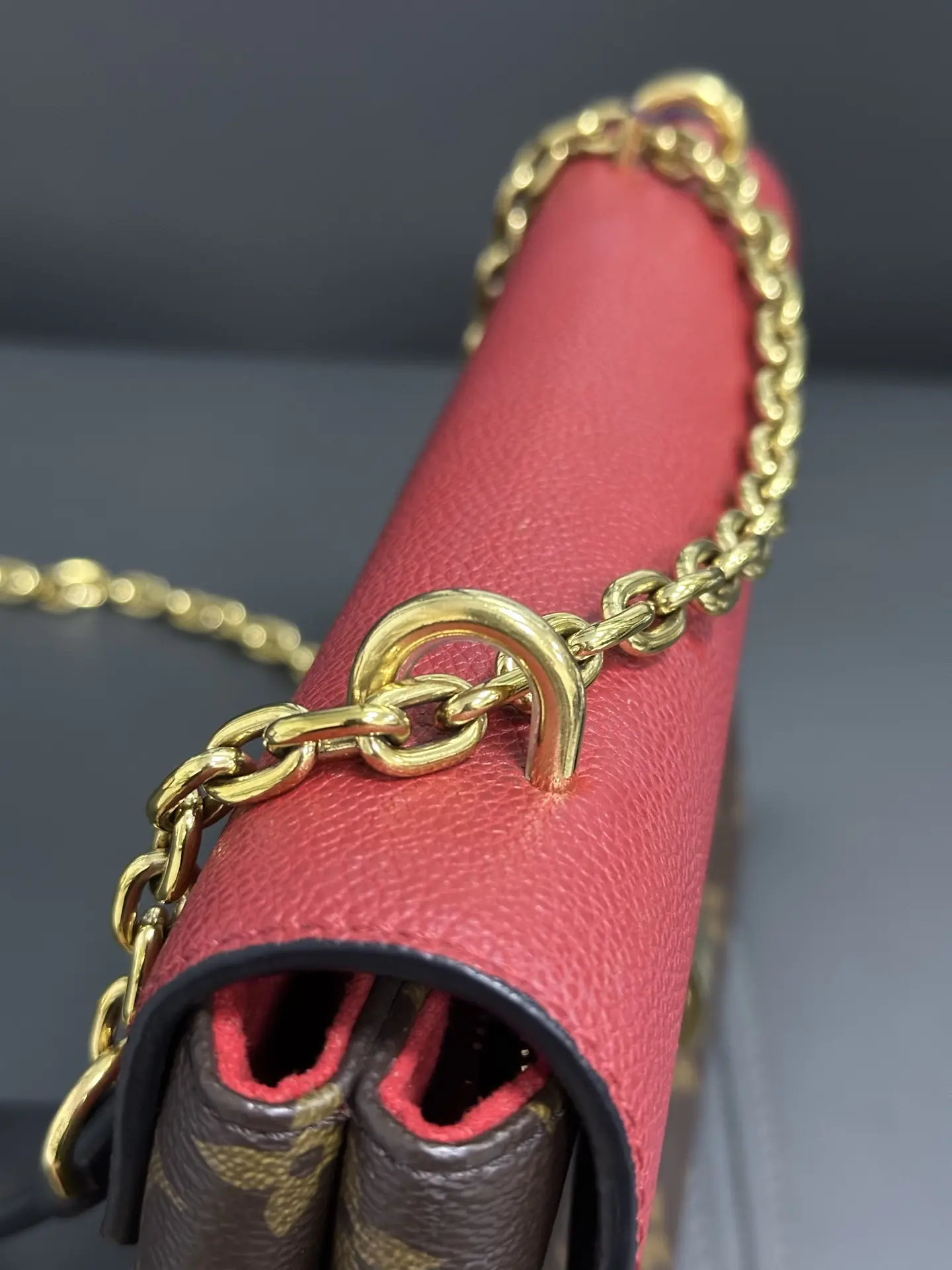 LOUIS VUITTON Saint Placide Envelope Bag in Red Monogram Empreinte Leather LOUIS VUITTON Saint Placide Envelope Bag in Red Monogram Empreinte Leather