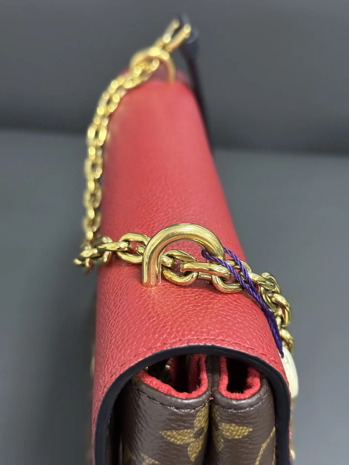 LOUIS VUITTON Saint Placide Envelope Bag in Red Monogram Empreinte Leather LOUIS VUITTON Saint Placide Envelope Bag in Red Monogram Empreinte Leather