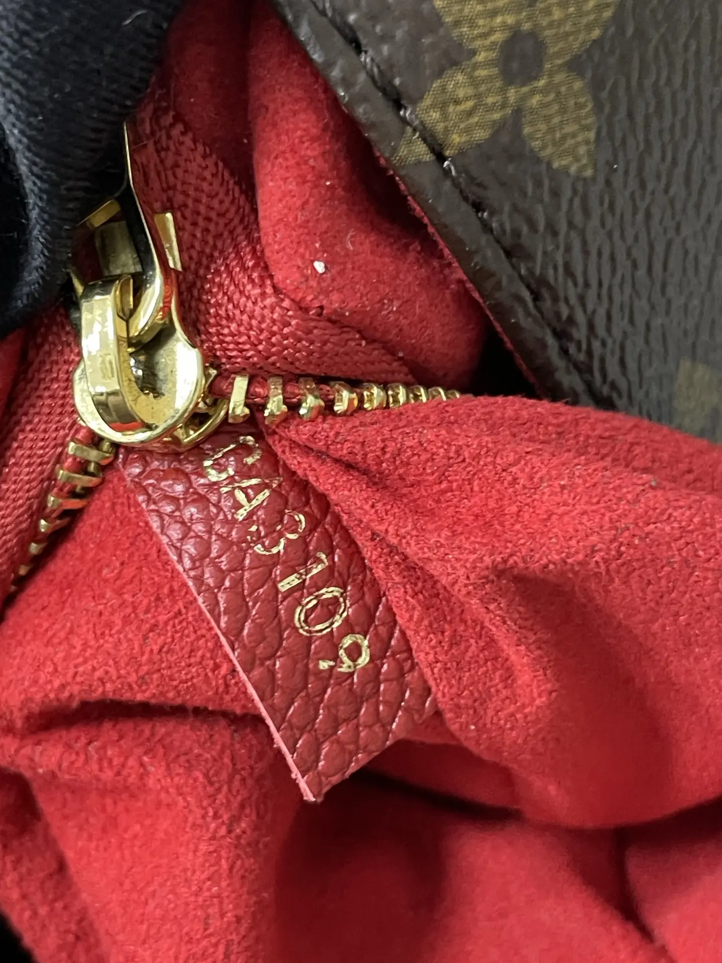 LOUIS VUITTON Saint Placide Envelope Bag in Red Monogram Empreinte Leather LOUIS VUITTON Saint Placide Envelope Bag in Red Monogram Empreinte Leather