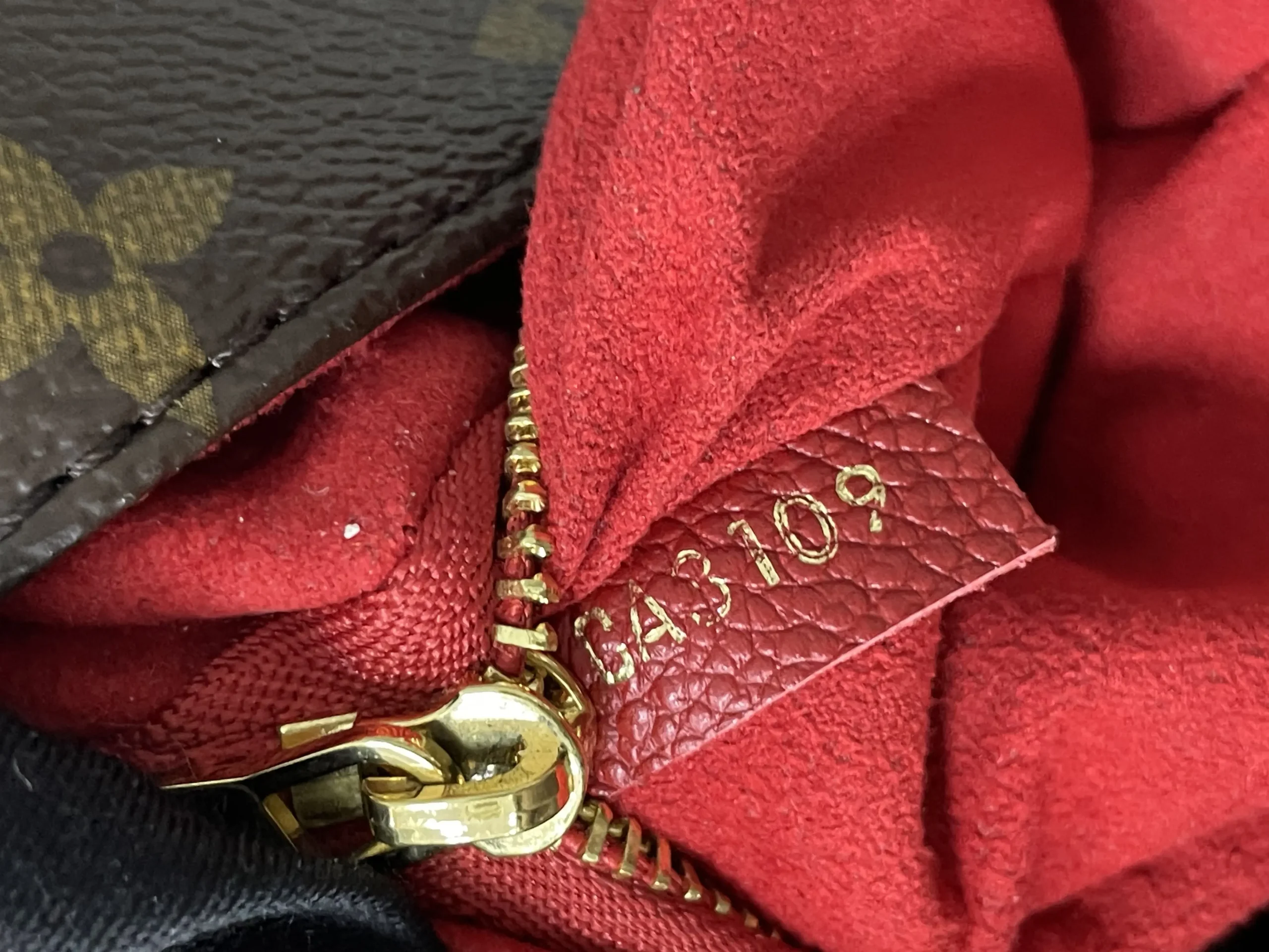 LOUIS VUITTON Saint Placide Envelope Bag in Red Monogram Empreinte Leather LOUIS VUITTON Saint Placide Envelope Bag in Red Monogram Empreinte Leather