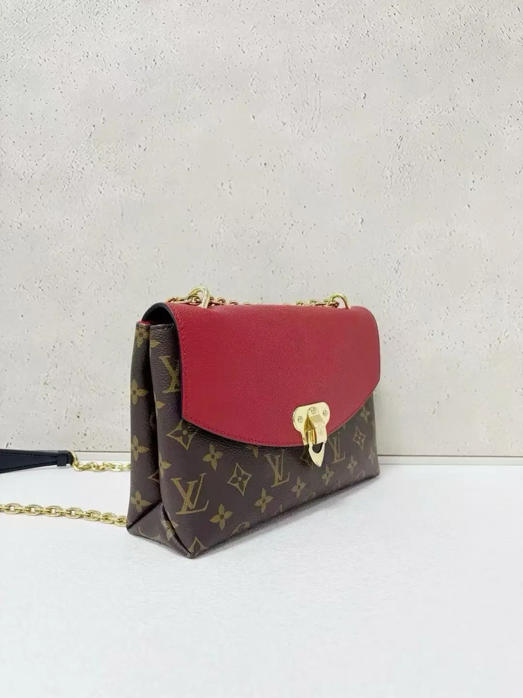 LOUIS VUITTON Saint Placide Envelope Bag in Red Monogram Empreinte Leather LOUIS VUITTON Saint Placide Envelope Bag in Red Monogram Empreinte Leather
