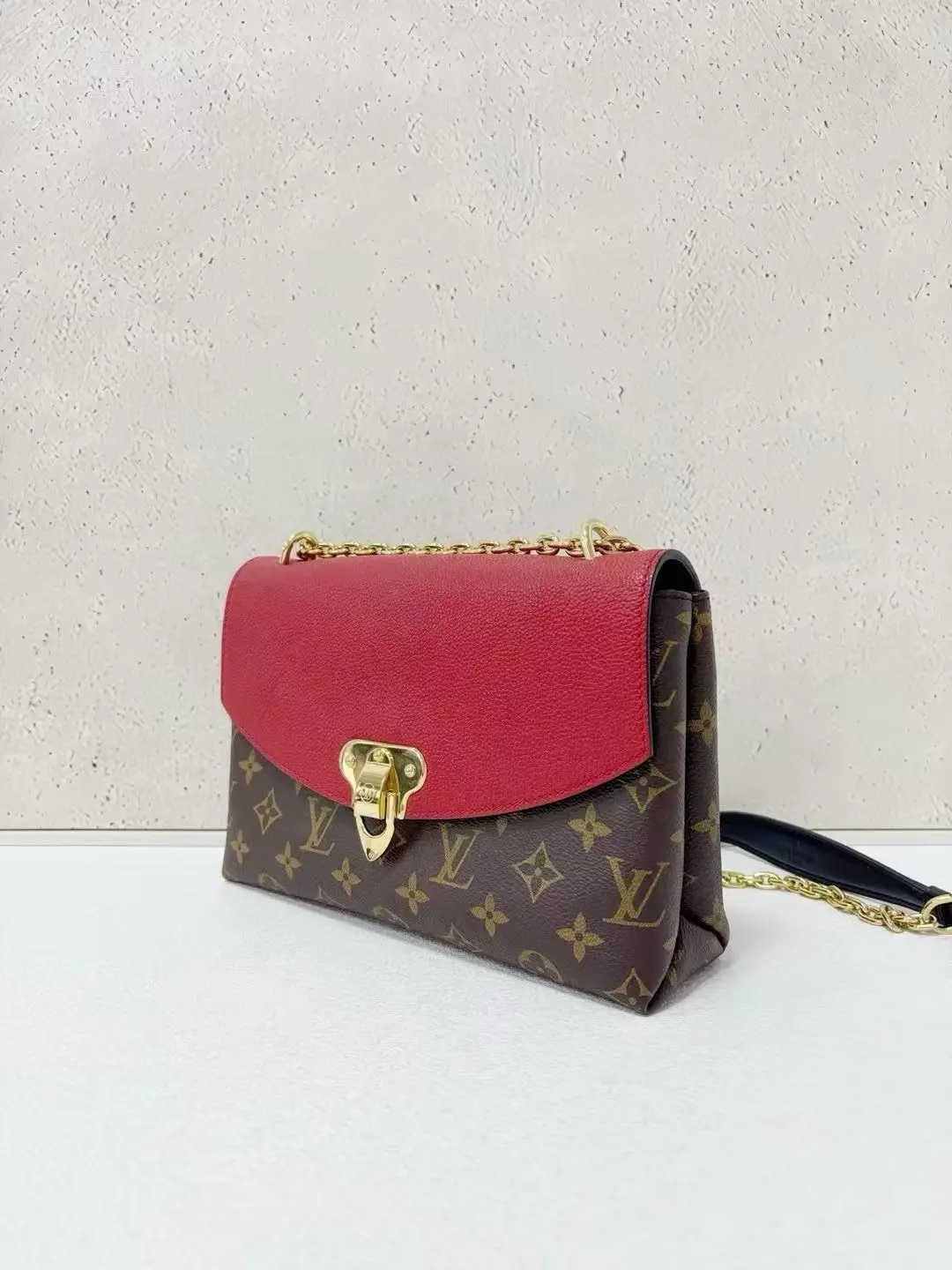LOUIS VUITTON Saint Placide Envelope Bag in Red Monogram Empreinte Leather LOUIS VUITTON Saint Placide Envelope Bag in Red Monogram Empreinte Leather