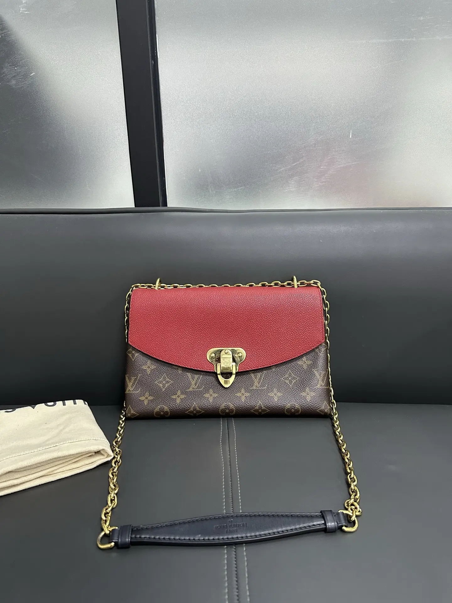 LOUIS VUITTON Saint Placide Envelope Bag in Red Monogram Empreinte Leather LOUIS VUITTON Saint Placide Envelope Bag in Red Monogram Empreinte Leather