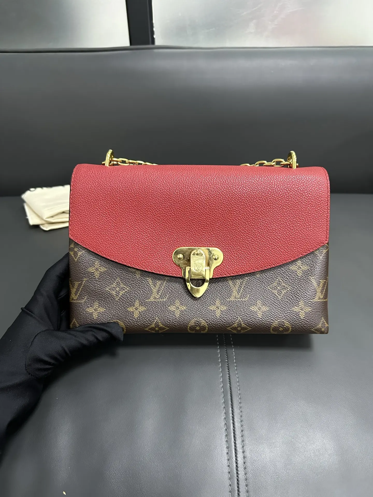 LOUIS VUITTON Saint Placide Envelope Bag in Red Monogram Empreinte Leather LOUIS VUITTON Saint Placide Envelope Bag in Red Monogram Empreinte Leather