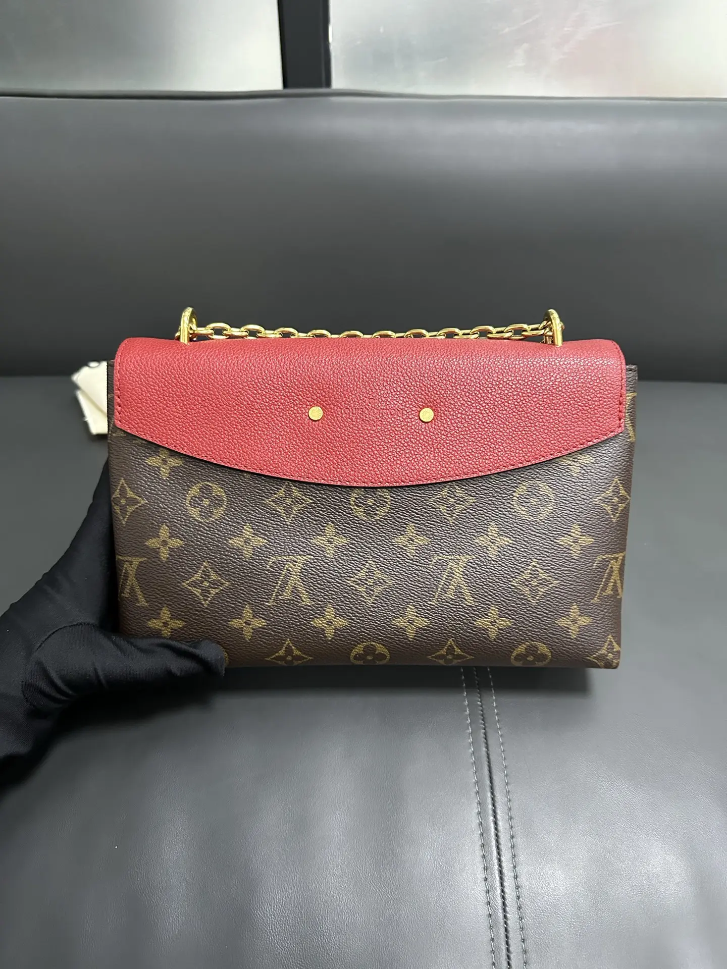 LOUIS VUITTON Saint Placide Envelope Bag in Red Monogram Empreinte Leather LOUIS VUITTON Saint Placide Envelope Bag in Red Monogram Empreinte Leather