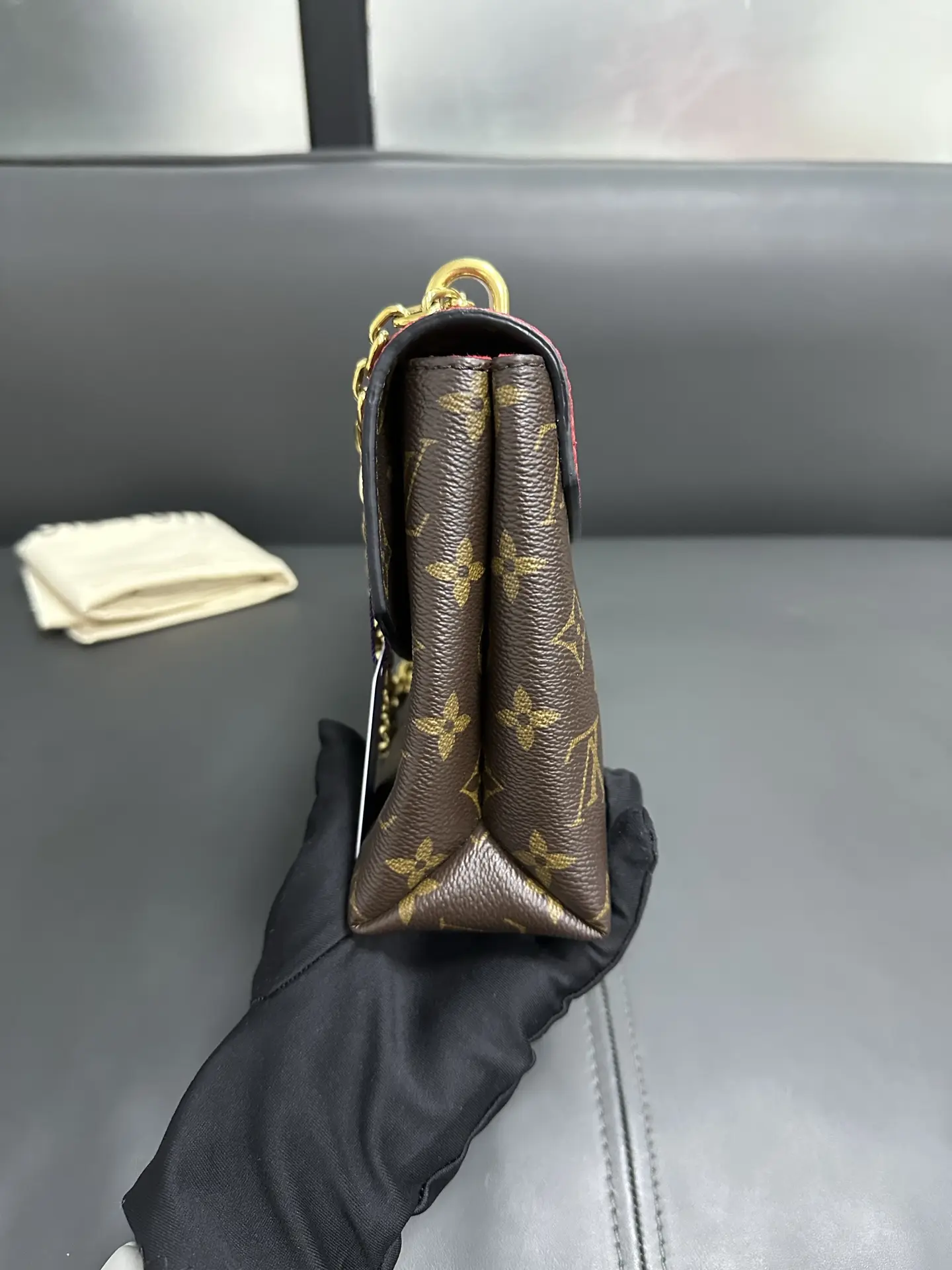 LOUIS VUITTON Saint Placide Envelope Bag in Red Monogram Empreinte Leather LOUIS VUITTON Saint Placide Envelope Bag in Red Monogram Empreinte Leather